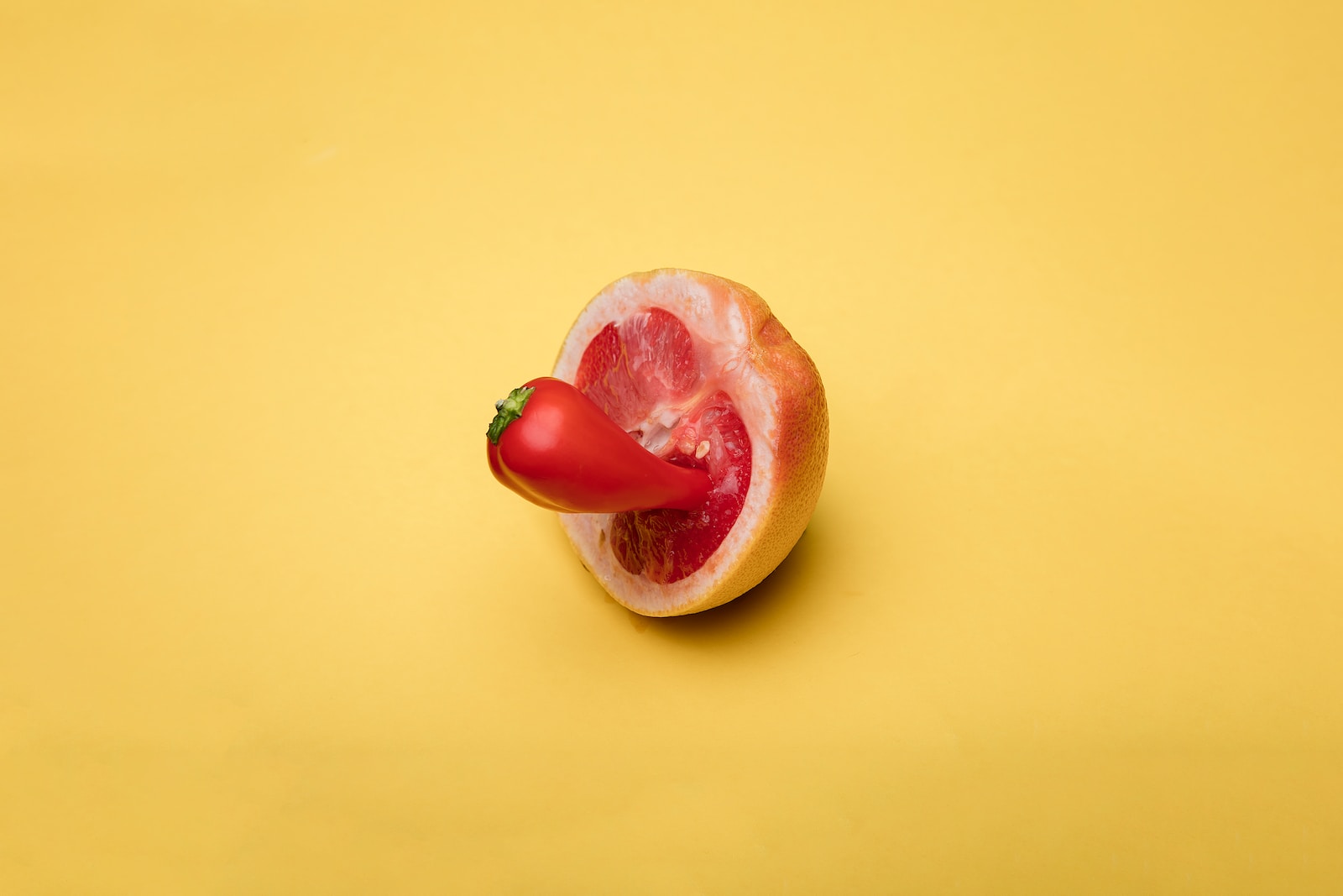 sliced apple fruit on yellow surface